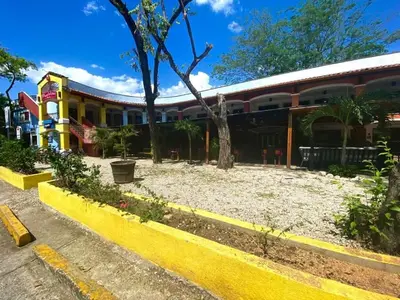 a building with a yard in front of it at Garza Real in Coco