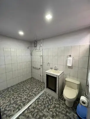 a bathroom with a toilet and a sink at Castro's Apartment in Fortuna