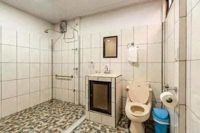 a bathroom with a toilet and a sink at Castro's Apartment in Fortuna