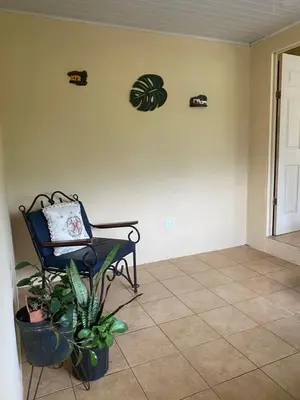 a empty room with a bench and a plant at Vista Serena in San Isidro
