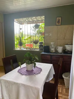 a kitchen with a table with a potted plant on it at Vista Serena in San Isidro