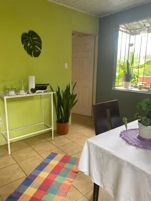 a dining room with a table and a window at Vista Serena in San Isidro