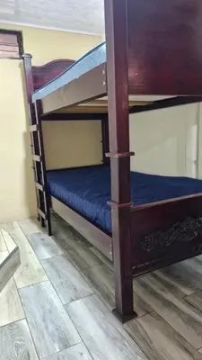 a couple of bunk beds in a room at House in the Woods in Guápiles
