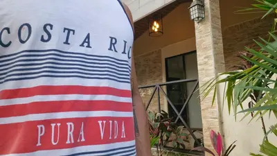 a sign for a pula villa in front of a building at House in the Woods in Guápiles