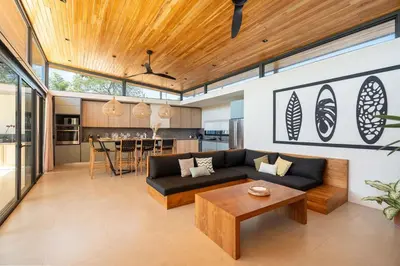 a living room with a couch and a table at Casa Avellanas in Playa Avellana