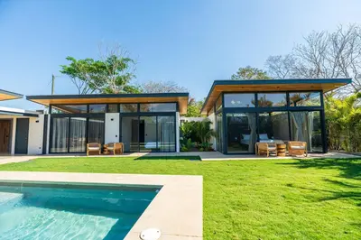 a house with a pool in front of it at Casa Avellanas in Playa Avellana