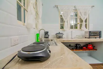 a kitchen with a toaster on top of a counter at Villas Mali La Fortuna in Guayabal