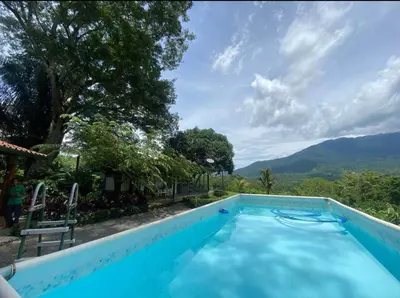 a swimming pool with a view of the mountains at Lapas House in Esperanza