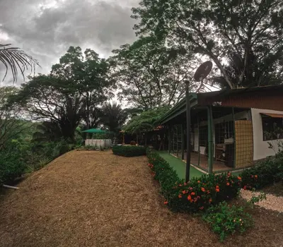a house with flowers in front of it at Lapas House in Esperanza
