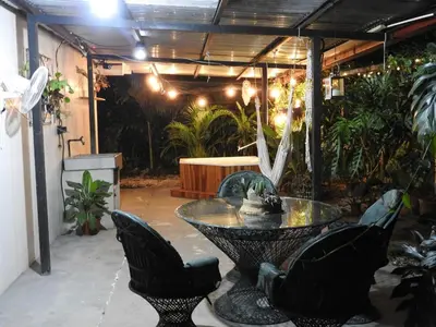 a patio with a table and chairs and a bench at Casa Mares in Lepanto