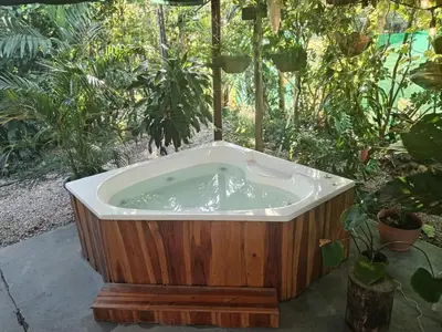 a bath tub in a garden with plants at Casa Mares in Lepanto