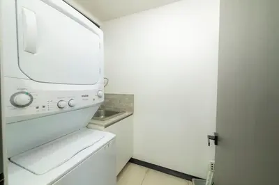 a white washer and dryer in a small kitchen at Casa Tatala - 2bdr home with pool near Santa Teresa beach in Boca de Ario
