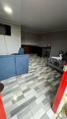 a living room with a couch and a floor at Mi refugio in Ciudad Cortés