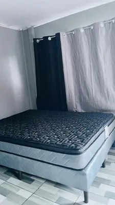 a bed sitting in a room with a mattressvisorvisor at Mi refugio in Ciudad Cortés