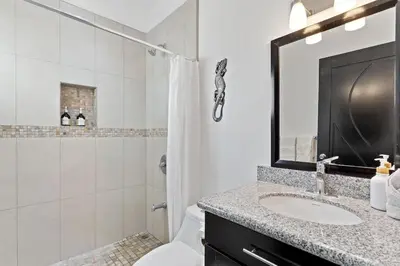a bathroom with a sink and a shower and a toilet at Cozy 3BR Townhouse Near Tamarindo-2 Pool&More in Santa Cruz