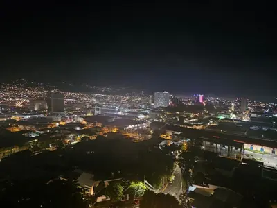 a view of a city at night with lights at Chic Studio in Barrio Escalante in Tapantí