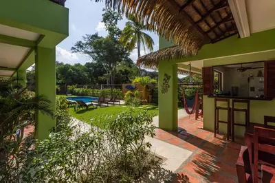 a view of the backyard of a house at Mavi Surf Hotel Dominical in Dominical