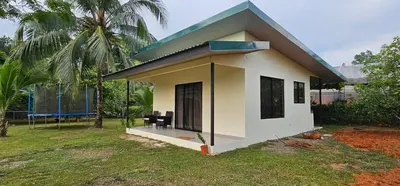 a small house with a blue roof at Casa Eden Near Manuel Antonio in Manuel Antonio