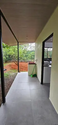 an empty room with a green mop on the floor at Casa Eden Near Manuel Antonio in Manuel Antonio