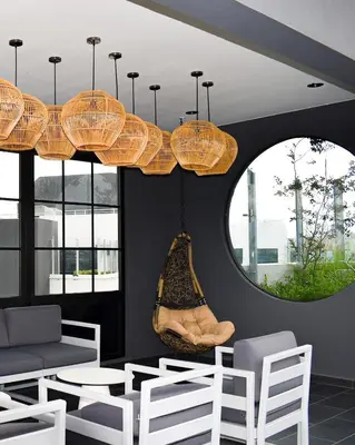 a living room with a couch and a swing at Gaia Retreat - Núcleo Sabana in San José