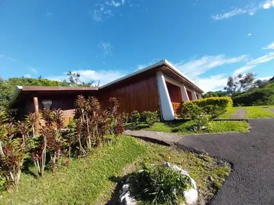 a house with a garden in front of it at Belcruz family lodge in Monteverde Costa Rica