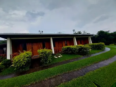 a house with a garden in front of it at Belcruz family lodge in Monteverde Costa Rica