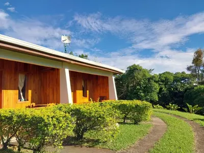 a house with a dirt road in front of it at Belcruz family lodge in Monteverde Costa Rica