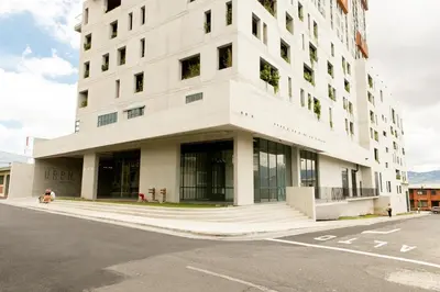a large white building on the corner of a street at Vista Aqua Escalante in San José