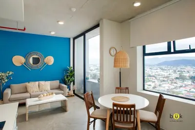 a living room with a table and a couch at Catorce Urbano in San José