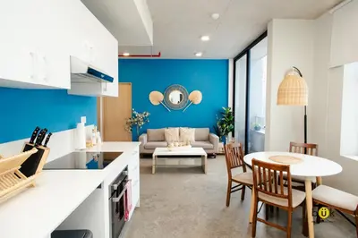 a kitchen and living room with a table and chairs at Catorce Urbano in San José