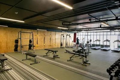 a gym with a bunch of treadms and machines at Horizonte 28 Escalante in San José