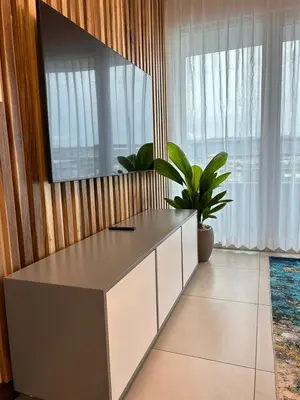 a desk in a room with a potted plant at Luxury 1BR Condo Stunning Views in San José