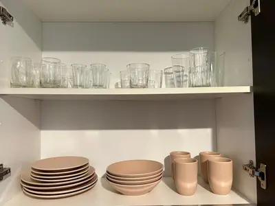 a kitchen with plates and glasses on a shelf at Luxury 1BR Condo Stunning Views in San José