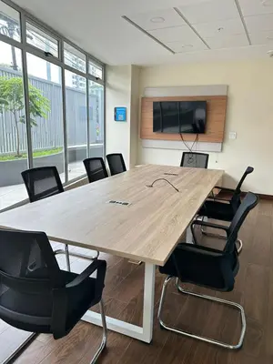 a conference room with a large wooden table and chairs at Luxury 1BR Condo Stunning Views in San José