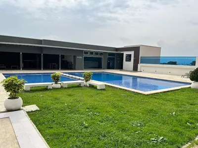 a large swimming pool in front of a building at Luxury 1BR Condo Stunning Views in San José