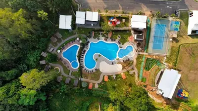 an aerial view of a house with a swimming pool at Macaw House with private pool in Arenas Herradura in Herradura