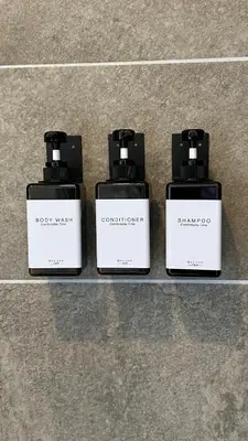 three perfume bottles are sitting on a counter at Walk to Private Beach Luxury amidst Nature in Puntarenas