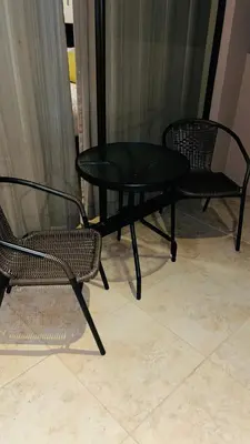 two chairs and a table and a table and two chairs at The Cove Door 15 and 16 Upper & Lower Unit in Ocotal