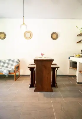 a room with a table in the middle of a room at Valmonte Coffee Farm in Santa María