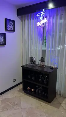 a room with a black dresser with a plane on it at The Cove Door 15 Main Floor Unit in Ocotal