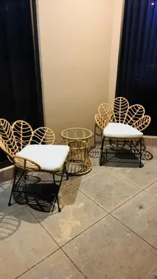 a group of chairs and tables in a room at The Cove Door 15 Main Floor Unit in Ocotal