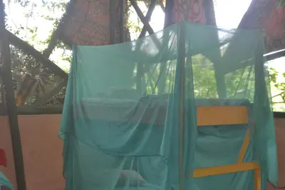 a canopy over a bed in a play tent at Hostel Piramys in Tapantí