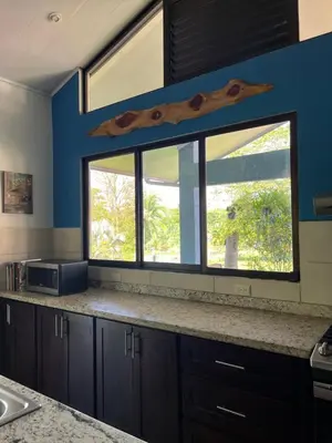 a kitchen with a window and a counter top at Nature, Peace & Tranquility in Northern Costa Rica in Santa Rita