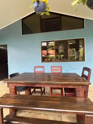 a large wooden table with chairs around it at Nature, Peace & Tranquility in Northern Costa Rica in Santa Rita