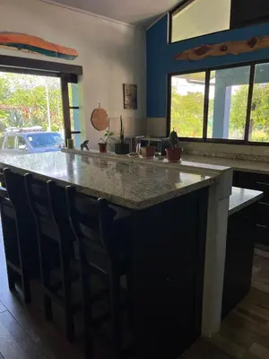 a kitchen with a large island with a counter top at Nature, Peace & Tranquility in Northern Costa Rica in Santa Rita