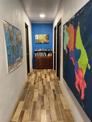 a hallway with a map of the world on the wall at Nature, Peace & Tranquility in Northern Costa Rica in Santa Rita