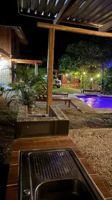 a outdoor grill in a yard at night at Cabaña Nacahome in Santa Cruz