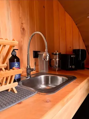 a kitchen counter with a sink in a kitchen at Epífita, Bosque Nuboso Glamping Monteverde in Monteverde Costa Rica