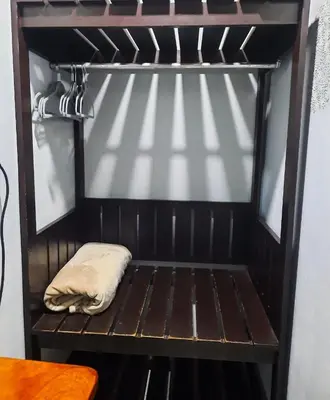 a wooden shelf with a pillow in a room at Iki Room with Jacuzzy in Fortuna