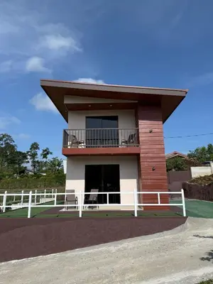 a small house with a balcony on top of it at Toucan Villa Rio Cuarto in Río Cuarto